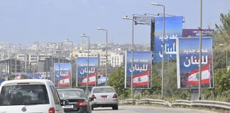 بالصور- طريق مطار بيروت يخلع مشهده الحزبي ويرفع العلم اللبناني: “عهد جديد للبنان”