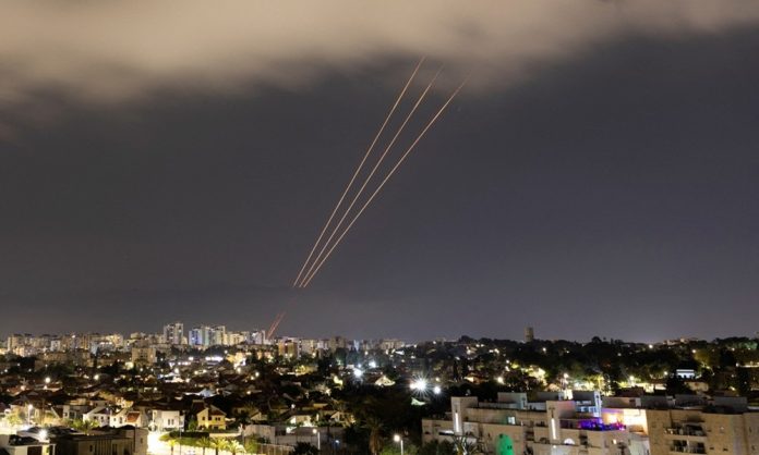 An anti-missile system operates after Iran launched drones and missiles towards Israel, as seen from Ashkelon